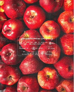 Pomme & Ciel apple packaging design — crate label artwork over a bed of red apples